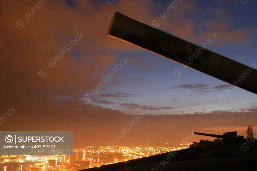 Spain. Barcelona. Sunset view of the port area from the Castle of Montjuic. Cannons.
