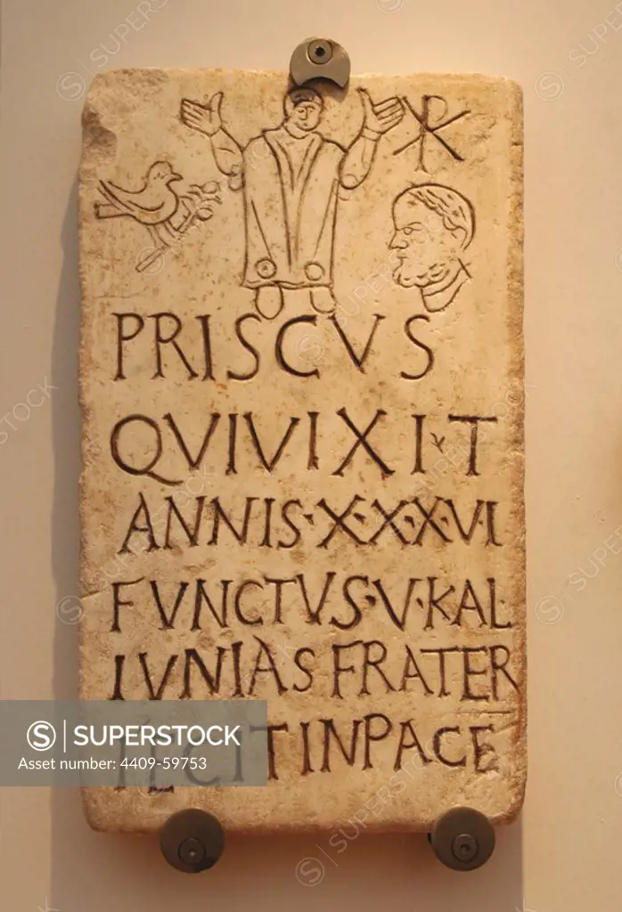 Italy. Early Christians. Roman funerary stele of Prisco. Inscription: Christian phrase appears "in pace". The symbol of the dove and the olive branch and the monogram of Constantine T. 4th century AD. Baths of Diocletian, part of the National Roman Museum Rome. Italy.