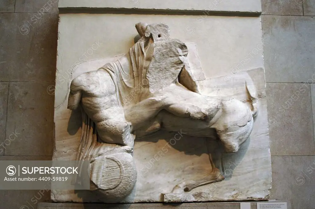 Greek Art. Metope on the south side of the Parthenon. 5th century B.C. Lapith fighting with a centaur and rolling on a jar. Metope IX. It comes from the Acropolis in Athens. British Museum. London. England. UK.