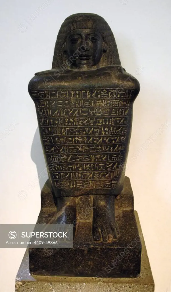 Granodiorite block-statue of Amenhotep. Rows of text at front. 18th Dynasty. New Kingdom period. British Museum. London. England. United Kingdom.