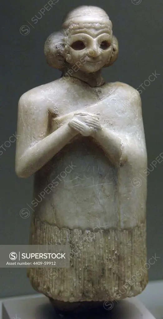 Mesopotamia. Gypsum statue of a woman. Early Dynatic period. 2400-2300 BC. Placed in an temple as an act of decotion. British Museum. London. England. United Kingdom.