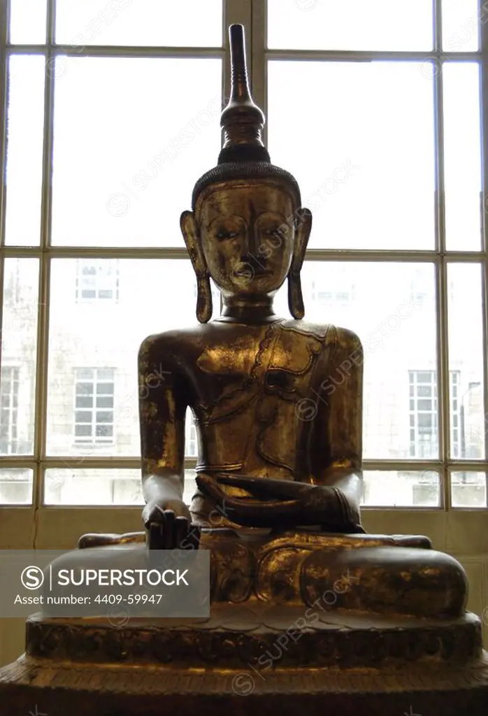 Dry lacquer sculpture of the Buddha. From Rangoon, Burma (Myanmar). Late 18th or early 19th C. AD. Seated in the lotus position. In Right hand is a myrobalan, medicinal fruit. British Museum. London. England. United Kingdom.