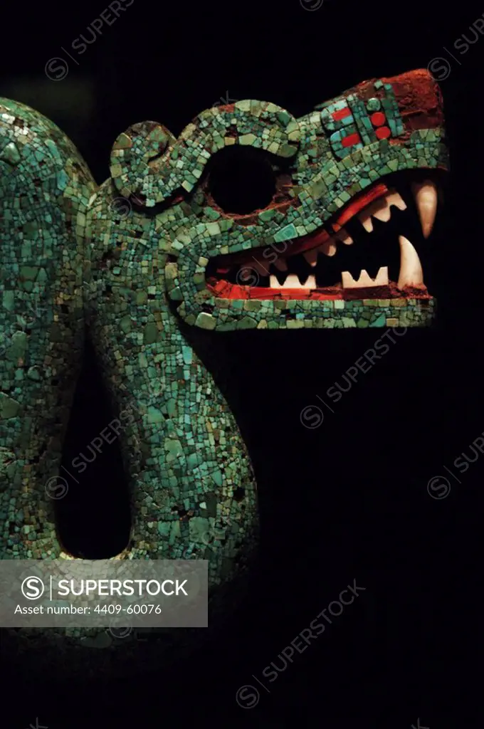 Pectoral, in the form of a double-headed serpent. Made of cedro wood and covered with mosaic made of turquoise and red thorny oyster shell. The teeth in the two open mouths are made from conch shell. Period Aztec /Mixtec. 1400-1521. Mexico. Detail of one of the heads. British Museum. London, England, United Kingdom.