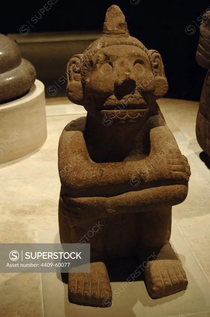 Pre-colombian era. Sandstone seated figure of Mictlantecuhtli, the Aztec god of death. The figure bears three glyphs on its back: 'Two Skull', 'Five Vulture' and 'Four House'. 1325-1521. The skeletal facial features depict Mictlantecuhtli, a minor Aztec deity and denizen of the Underworld (Mictlan). Mexico. British Museum. London, England, United Kingdom.
