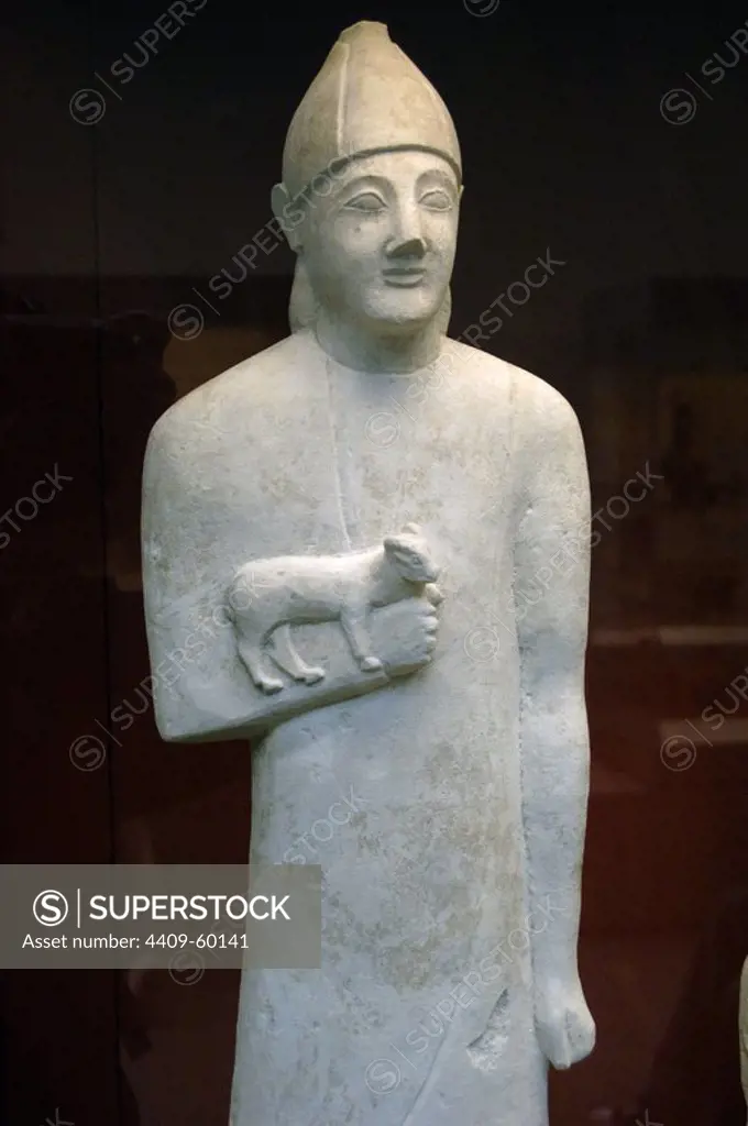 Statue of a devotee holding a small animal as an offering in his right hand. Limestone. Carved in Cyprus, 600 BC. From the Sanctuary of Apollo at Phrangissa, Tamassos. British Museum. London. England. United Kingdom.