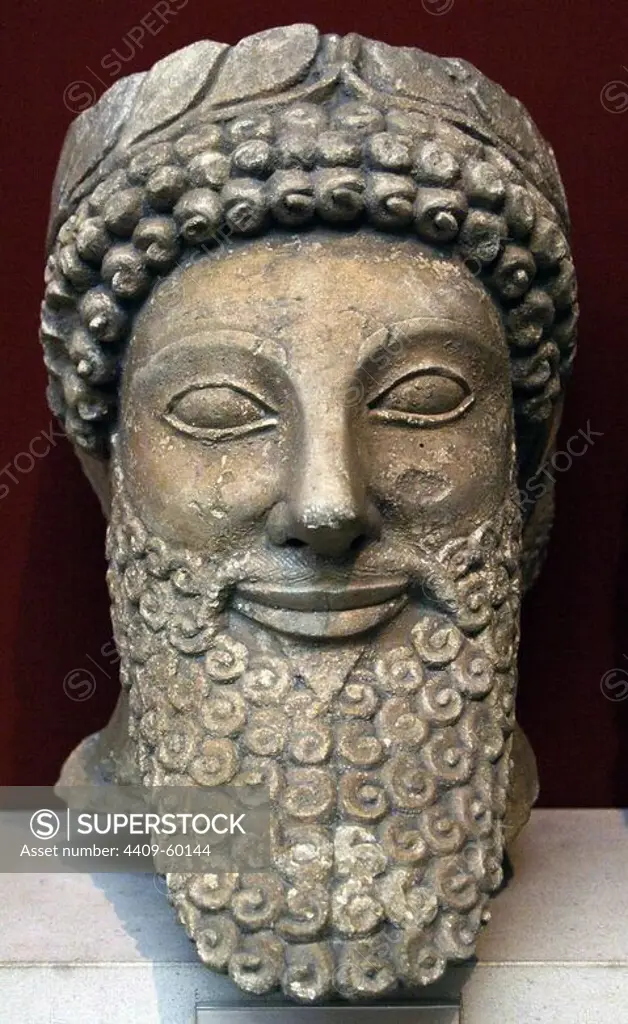 Head from a statue of a bearded man with laurel wreath. Limestone. Sculpted in Cyprus early 5th century BC. From the Sanctuary of Apollo at Pyla. British Museum. London. England. United Kingdom.