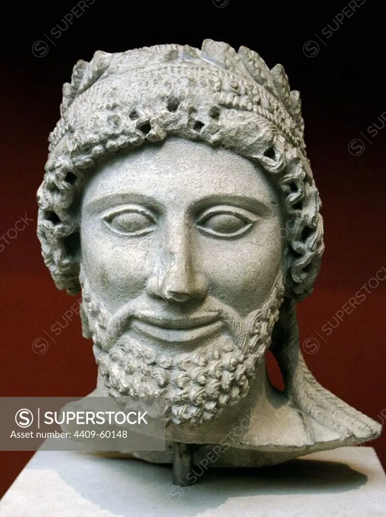 Head from a statue of a bearded man with laurel wreath. Limestone. Sculpted in Cyprus between 475-450 BC. From the Sanctuary of Apollo at Idalion. British Museum. London. England. United Kingdom.
