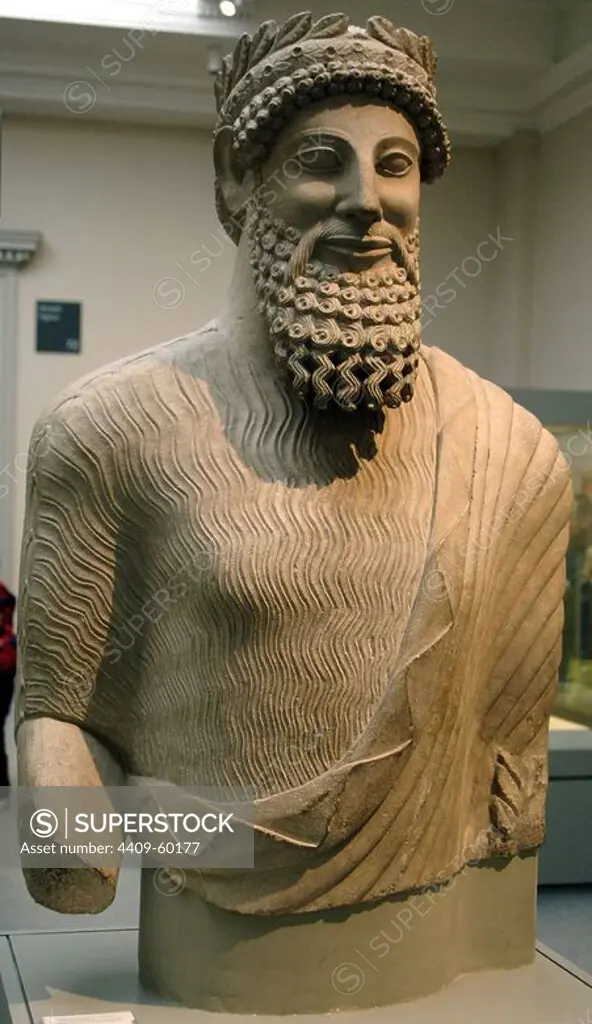 Colossal statue of a bearded man with laurel wreath. Probably a priest. Limestone. Sculpted in Cyprus between 500-480 BC. From the Sanctuary of Apollo at Idalion. British Museum. London. England. United Kingdom.