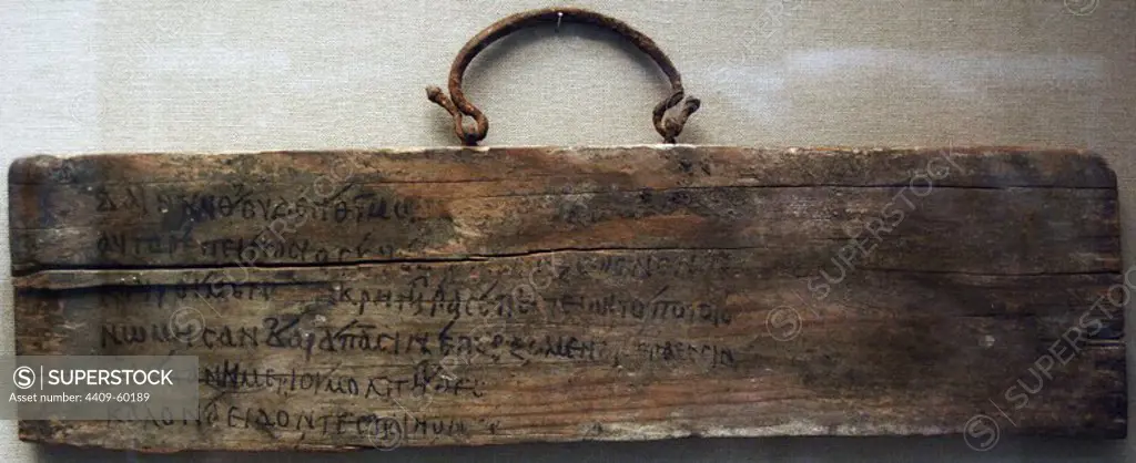 Wooden board with iron handle inscribed in ink with lines 468-473 from Book I of Iliad by Homer. 1st-2nd century AD. Roman. From Egypt. British Museum. London. England. United Kingdom.