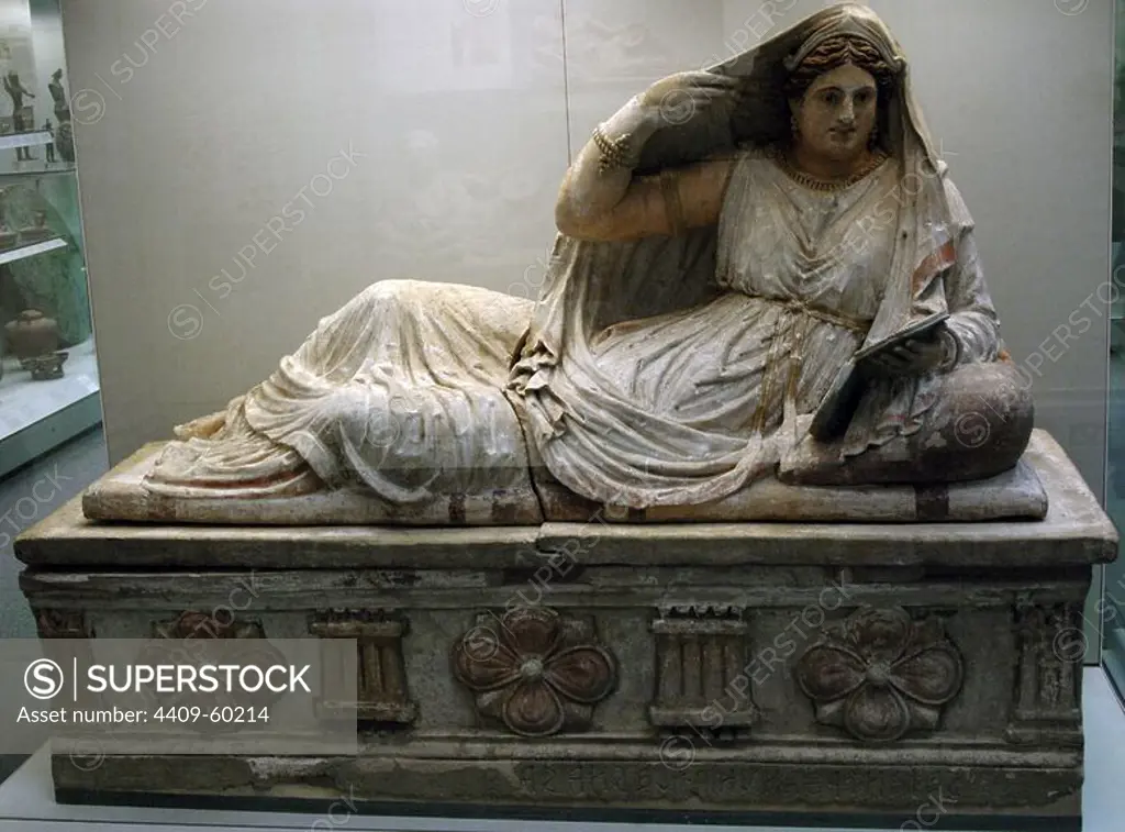 Etruscan sarcophagus of Seianti Hanunia Tlesnasa. Polychromed terracotta. 150-140 BC. Is depicted reclined and resting on a pillow, holding a mirror in her left hand and putting the cloak with right hand. From Poggio Cantarello (near Chiusi, Italy). British Museum. London. England. United Kingdom.