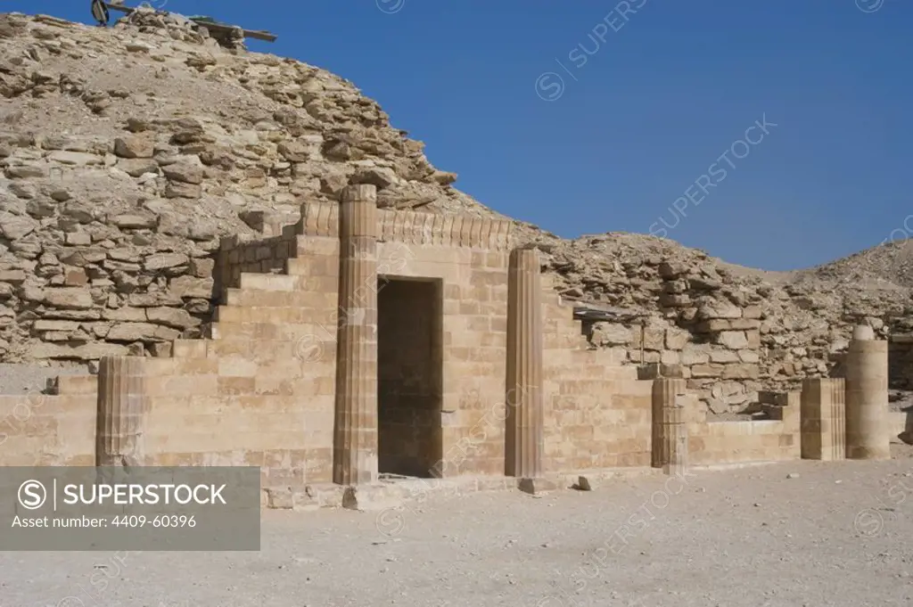 Egypt. Saqqara. Djoser's complex. The South House just east of the pyramid of Djoser. Is a symbolic building decorated with four fluted columns forty feet high, with niches for offerings. Old Kingdom.