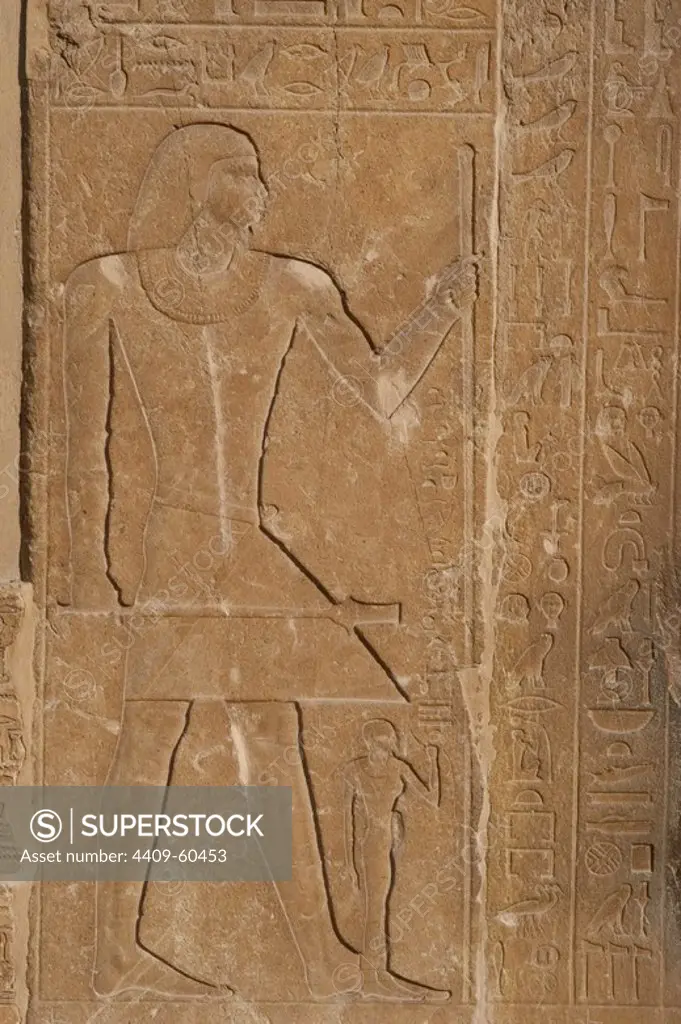 Egypt. Necropolis of Saqqara. Mastaba of Mereruka, priest of Pharaoh Teti. 2.340 B.C. Southern entrance. Detail with a relief depicting the deceased Mereruka with his wife, Watetkhethor, daughter of king Teti. She is standing at her husbands feet.6th Dynasty. Old Kingdom.
