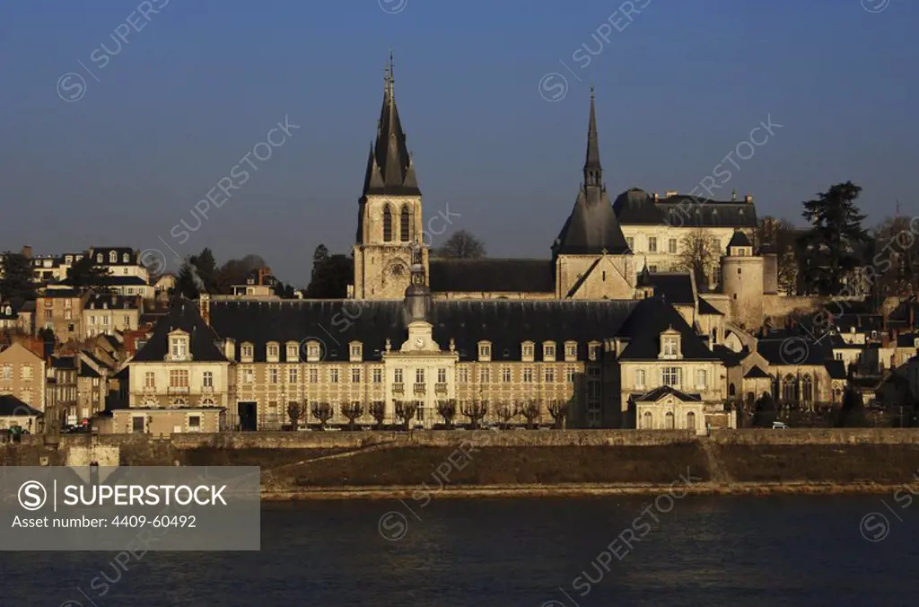 France. Blois. Cityscape at the banks of Loira river with the Church Saint-Nicolas-Saint-Lomer, ancient abbey built between 12th and 13th centuries.