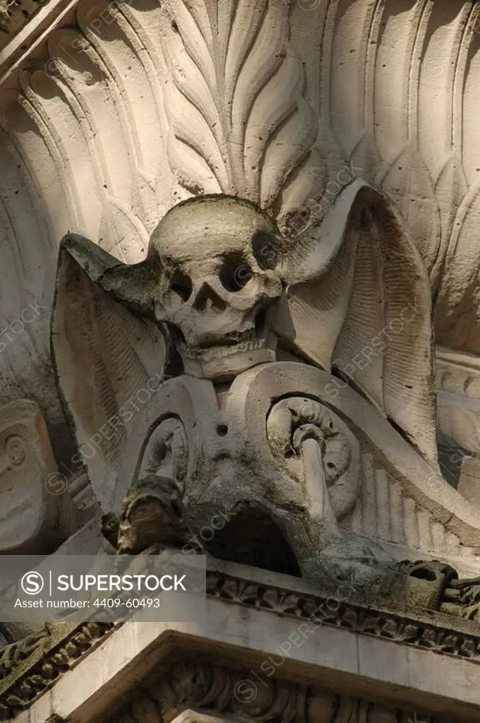 Pere Lachaise Cemetery. Winged skull. Sculptural detail of a mausoleum. Paris. France.