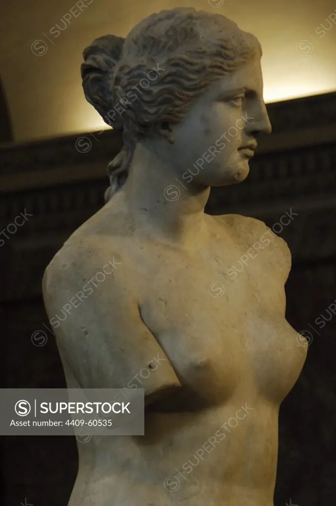 Greek Art. Statue of Aphrodite of Milos, known as the Venus de Milo (130-100 B.C.) by Alexandros of Antioch. Marble. It is believed to depict the Greek goddess of love and beauty, Aphrodite. Three-quarter view. Detail. Louvre Museum. Paris. France.