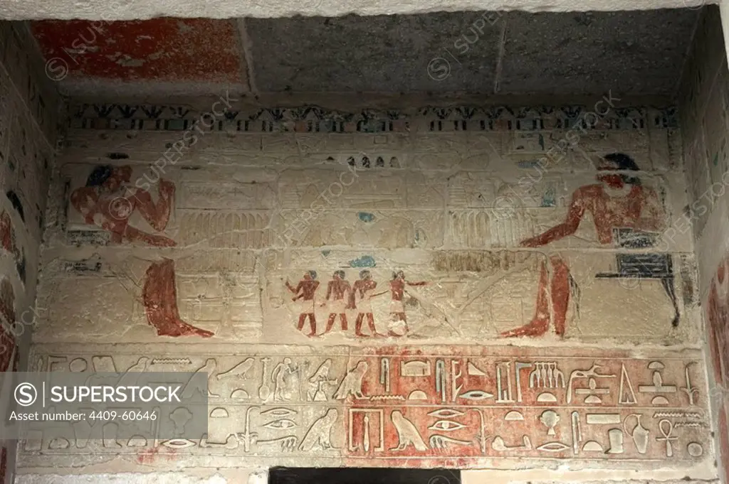 Mastaba of Nefer and Kahay. Polychromed relief depicting the deceased seated before the offerings' table while the servants show him more food. 5th Dynasty. Old Kingdom. Saqqara. Egypt.