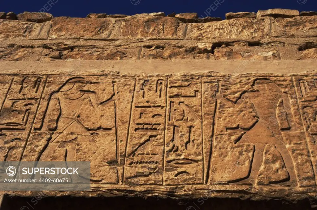 Egyptian Art. Necropolis of Saqqara. Male figures and hieroglyphs that decorate a mastaba. Relief. Entrance. Old Kingdom. Egypt.