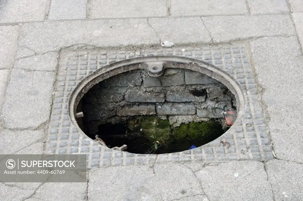 Albania. Tirana. A sewer hole uncovered.