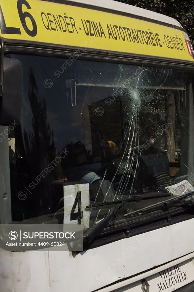 Front window of a bus broken. Tirana. Republic of Albania.