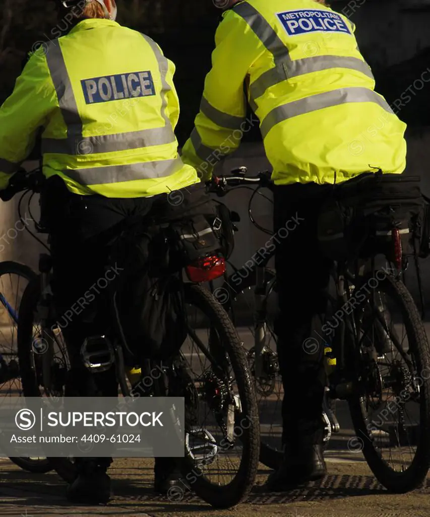 United Kingdom. England. London. Policemen patrolling in bicycle.