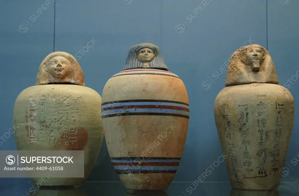 Polychormed canopic jars. Used by the egyptians during the mummification to preserve the viscera. On the left, painted jar of a child of the Royal Nursery of Ahmose. 1500 BC. From Upper Egypt. In the center, painted jar without inscription. 1450 BC. On the right, jar with hieroglyphic text. 1500 BC. Unknown origin. British Museum. London. United Kingdom.