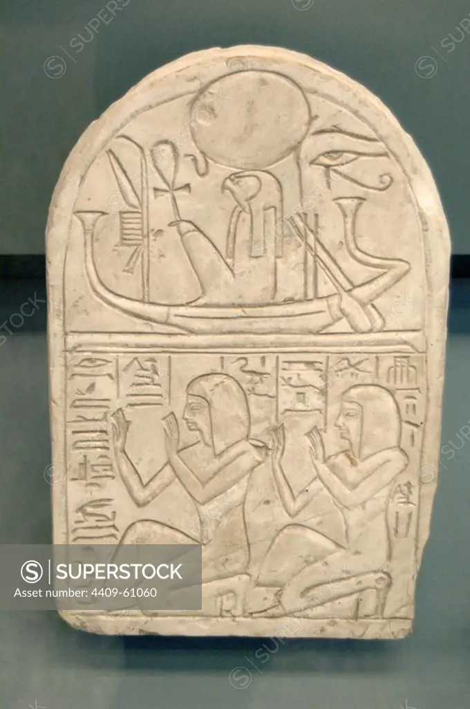 Stela of Wennekhu. In the upper register, the god Ra depicted in the solar boat with the falcon-headed. In the lower register, the workman Wennekhu and his son Penpakhenty kneeling adorating Ra.1250 BC. 19th Dynasty. New Kingdom. Limestone. Probably from Deir el-Medina. British Museum. London. United Kingdom.