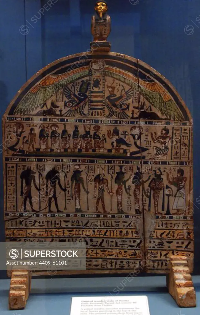 Painted wooden stela of Neswy with his Ba at the top. The scenes shown arranged in horizontal bands, from top to bottom, the winged solar disk flanked by the goddesses Nekhbet and Wadket as snakes and Anubis as a jackal; the deceased worshiping the Sun God and other deities in the solar boat; the deceased before Osiris, Isis, Nephthys, Horus, Hathor, Anubis and Wenawet. Early Ptolemaic Period. 3rd century BC. Probably from Thebes. British Museum. London. United Kingdom.