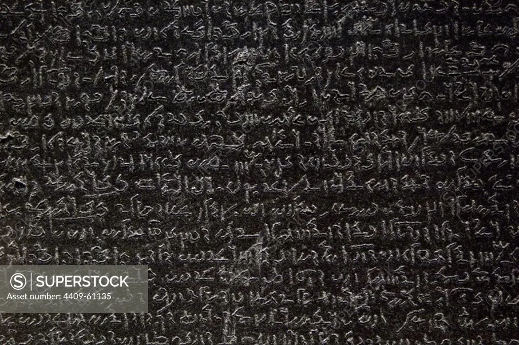 The Rosetta Stone. Fragment of a black granite stele with an inscription in different languages __of a decree of Ptolemy V Epiphanes king. Ptolemaic era. 196 BC. Detail. Demotic scripture. British Museum. London. United Kingdom.
