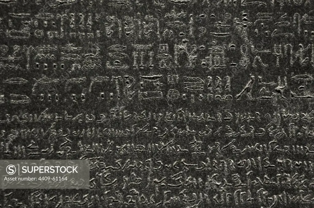 The Rosetta Stone. Fragment of a black granite stele with an inscription in different languages __of a decree of Ptolemy V Epiphanes king. Ptolemaic era. 196 BC. Hieroglyphical and demotic scripture. Detail. British Museum. London. United Kingdom.