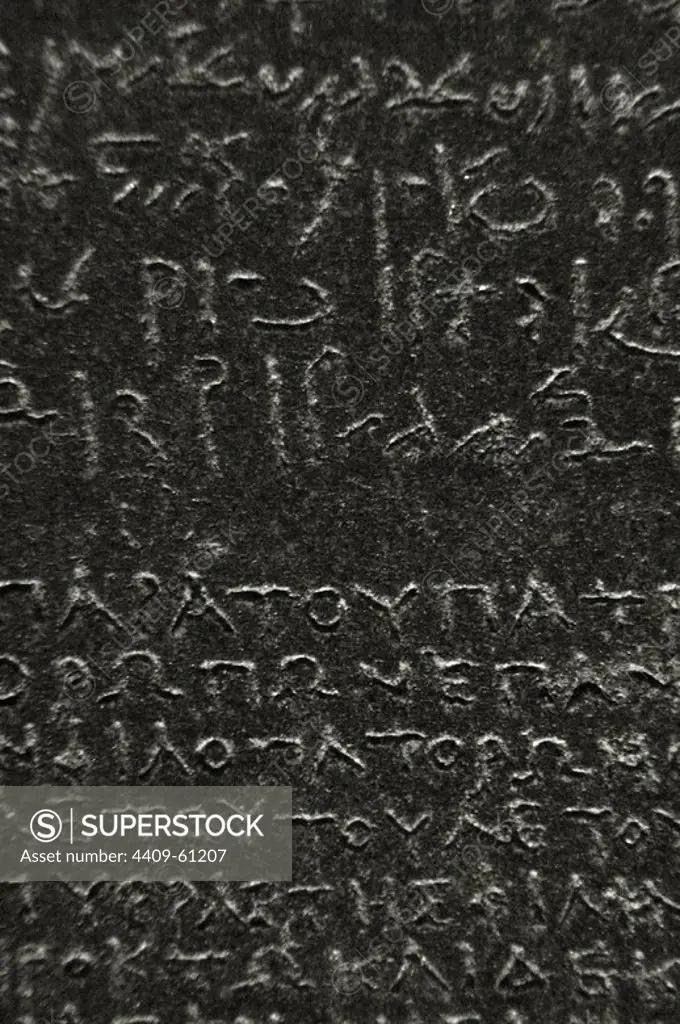 The Rosetta Stone. Fragment of a black granite stele with an inscription in different languages __of a decree of Ptolemy V Epiphanes. Ptolemaic era. 196 BC. Hieroglyphical and demotic scripture. Detail. British Museum. London. United Kingdom.