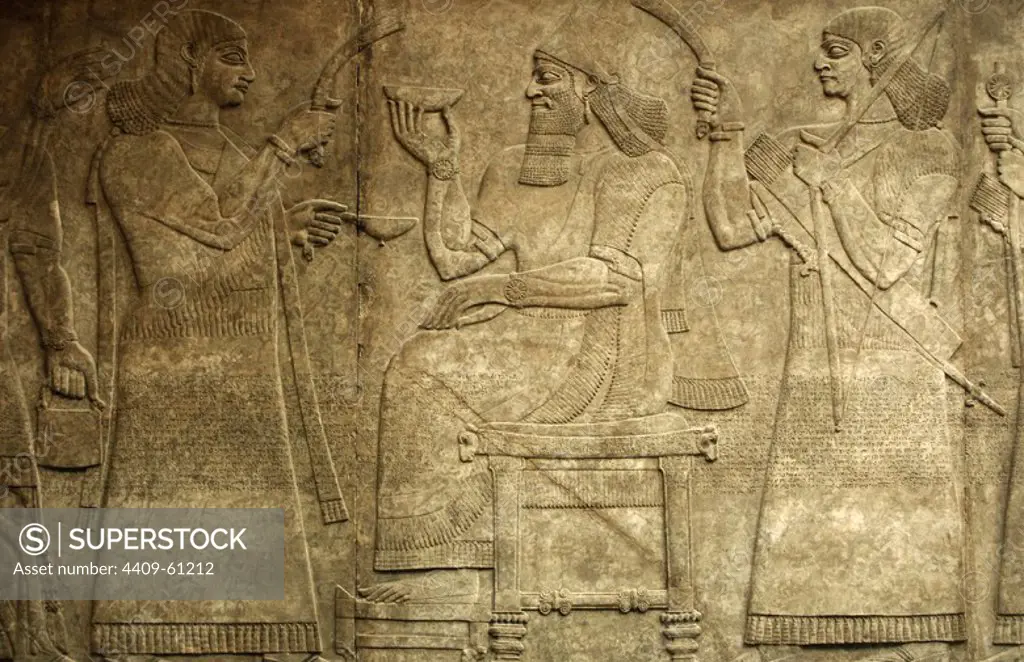 Relief depicting a court scene. King Ashurnasirpal II seated on his throne between two assistants. 865-860 BC. From Nimrud. Northwest Palace. British Museum. London. United Kingdom.