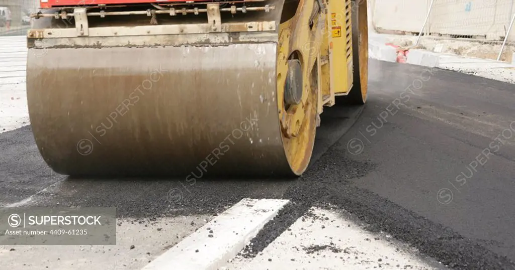 Road roller on asphalt pavement works. Barcelona. Spain.