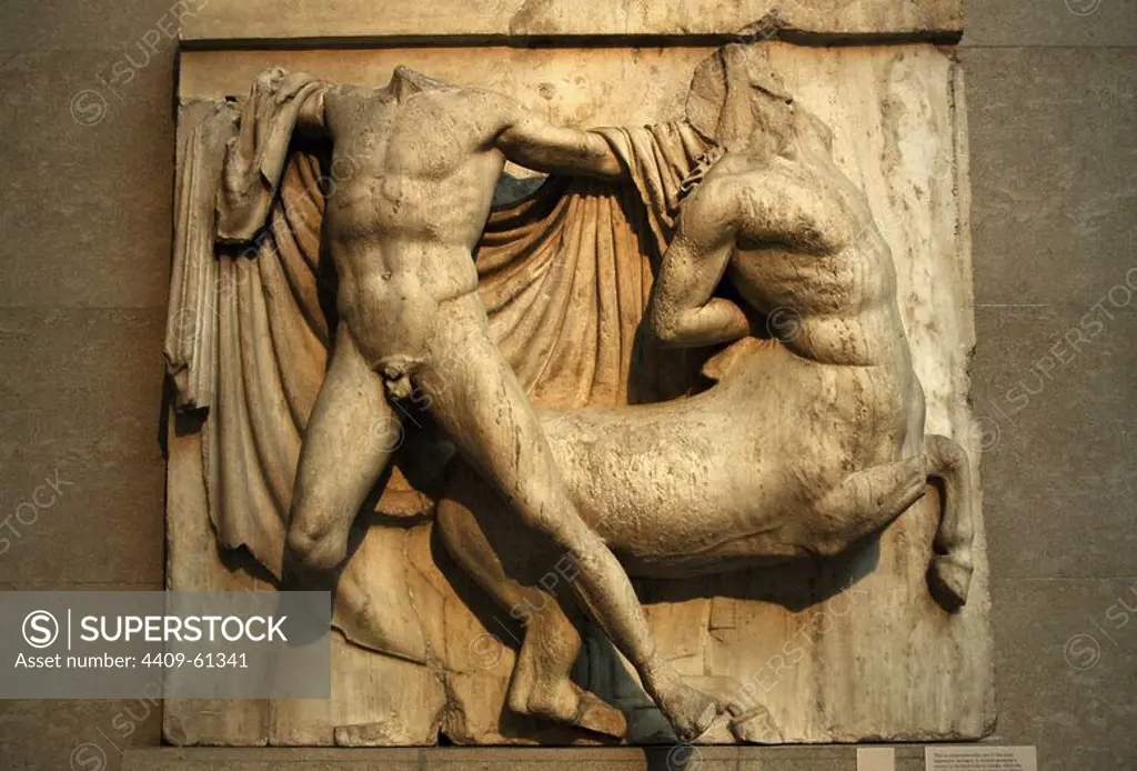 Greek Art. Metope on the south side of the Parthenon. 5th century B.C. A centaur, pressing a wound in the back, trying to escape while is retained by a Lapith. Metope XXVII. It comes from the Acropolis in Athens. British Museum. London. England. UK.