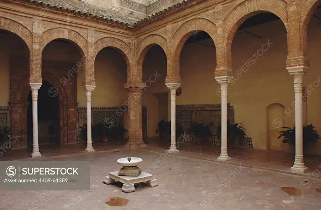 Spain. Andalusia. Seville. Island of the Charterhouse. Monastery of Our Lady of the Caves, founded in 1399 by Gonzalo de Mena, Archbishop of Seville. Royal Pavilion at the Seville Universal Exposition (Expo '92). Since 1997 hosts the Andalusian Center of Contemporary Arts. Cloister. Mudejar Architecture of the second half of 15th century. The columns are of white marble with bell capital of Moorish influence.