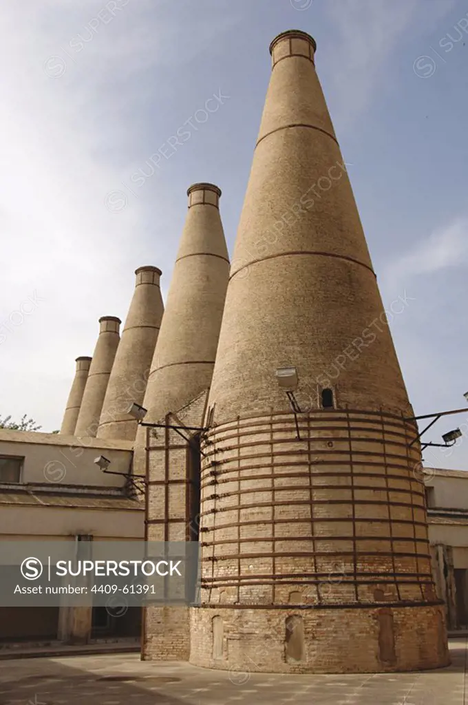 Spain. Andalusia. Sevilla. Isla de la Cartuja. Chimneys of the ceramic tile factory installed in the Monastry of Our Lady of the Caves (Monastery of The Cartuja). Acquired by Charles Pickman in 1839, it became a factory of ceramic and porcelain in 1849.