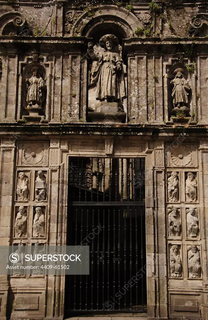 Santiago de Compostela, La Coruna province, Galicia, Spain. The Cathedral. Holy Door or Door of Pardon (1611). It is only opened in Jubilee Years. The niches contain the image of St. James and his disciples Athanasius and Theodore at his side (Baroque style). On the bottom and sides of the door were placed 24 figures of prophets and apostles coming from the old stone choir of Master Mateo (Romanesque style). East facade, architectural detail.