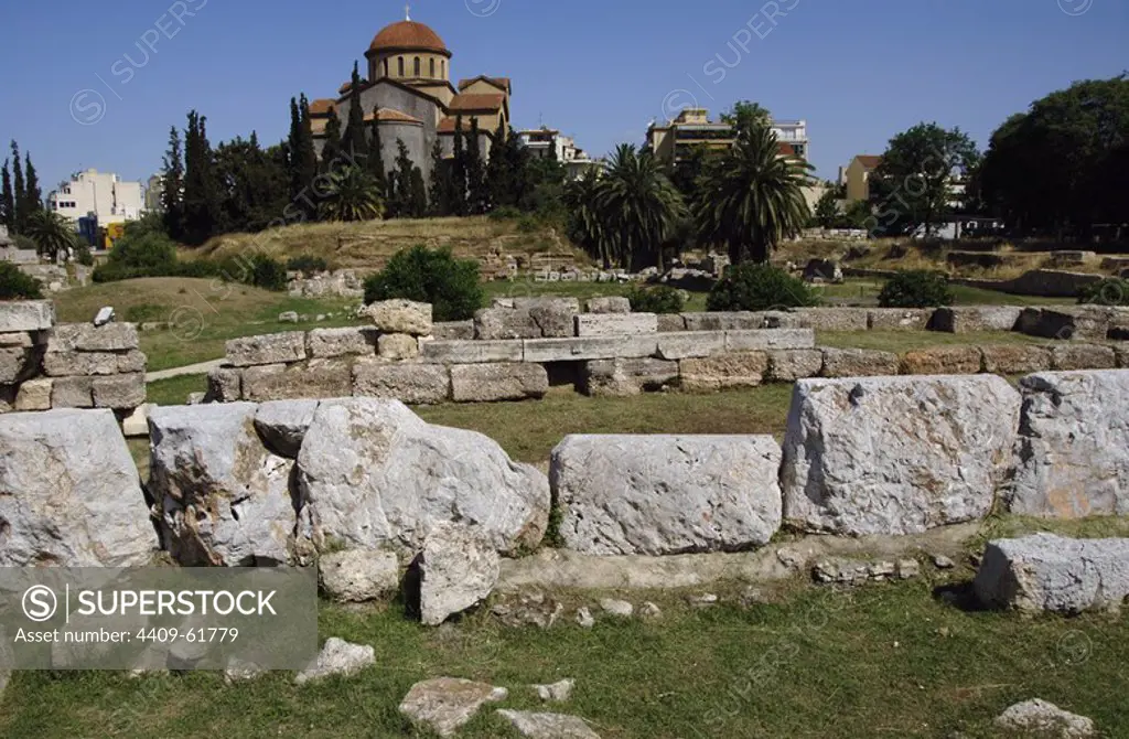 Greece, Athens. Area of Kerameikos (Ceramicus). Its name derives from "potter's quarter". Northwest of the Acropolis. Old cemetery. Ruins. Agia Triada Church at back.
