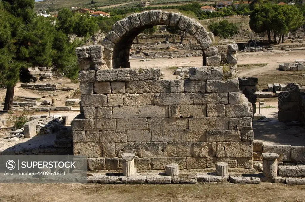 Greece. Peloponnese. Archaeological site of Corinth. Ruins of an arch of a shop in the Ancient Agora.