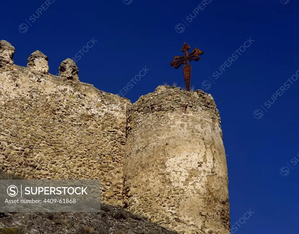 Spain. La Rioja. Clavijo. Medieval castle, architectural detail. A large cross of Santiago stuck upon a tower recalls the legend Battle of Clavjio in 844, which took place during the Reconquest. La Rioja Baja.