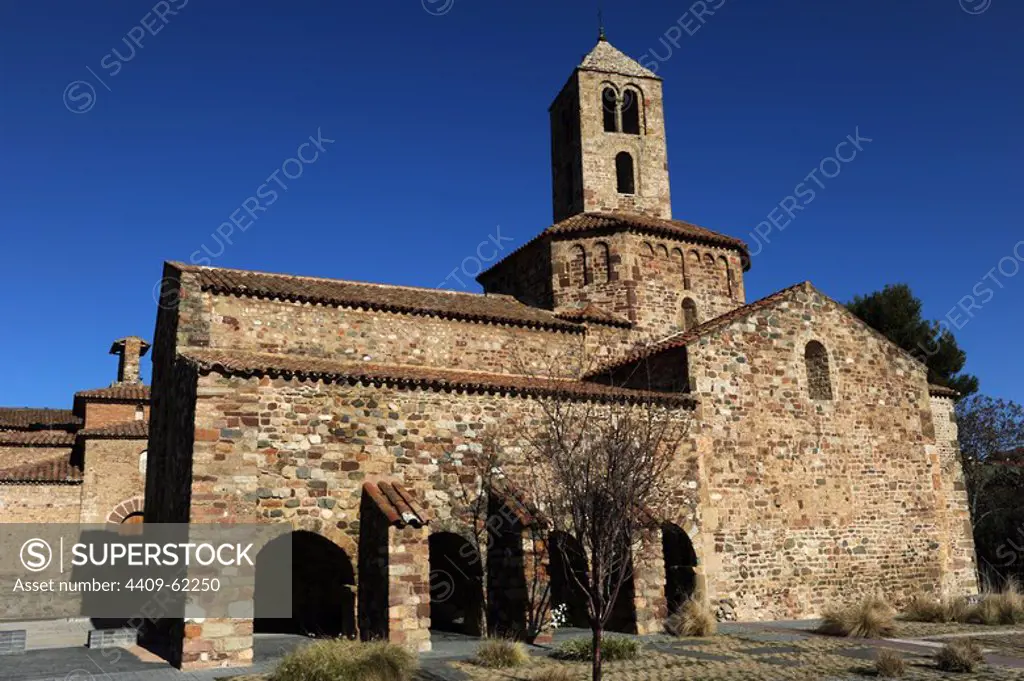 Romanesque art. Spain. 12th century. Church of St. Mary, consecrated in 1130. Exterior view of square apse, the octogonal dome crowned with two-story bell tower and south facade with remains of a portico with four arches, ancient cloister of augustines. Tarrasa. Catalonia.