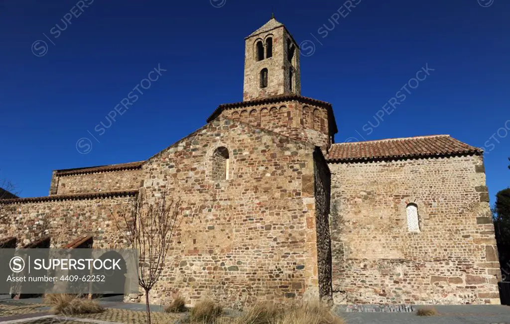 Romanesque art. Spain. 12th century. Church of St. Mary, consecrated in 1130. Exterior view of square apse, the octogonal dome crowned with two-story bell tower and south facade with remains of a portico with four arches, ancient cloister of augustines. Tarrasa. Catalonia.