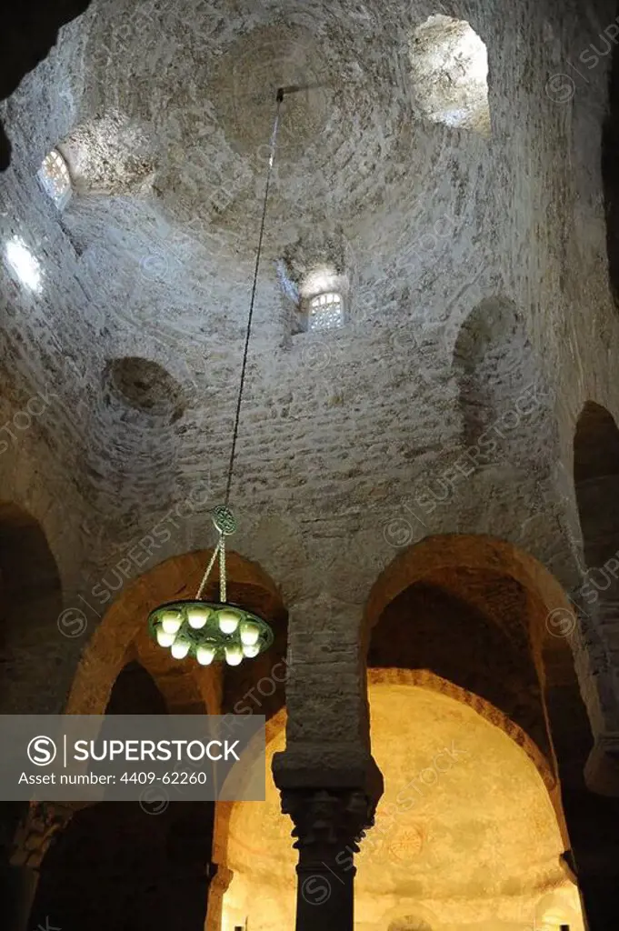 Romanesque Art. Spain. Church of St. Michael (San Miguel). Domed dome supported by eight columns made with Visigothic fragments and four Romanesque capitals. Inside view. Tarrasa. Catalonia.