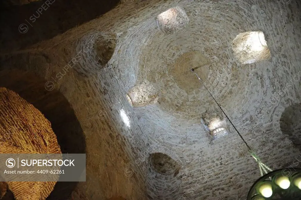Romanesque Art. Spain. Church of St. Michael (San Miguel). Domed dome supported by eight columns made with Visigothic fragments and four Romanesque capitals. Inside view. Tarrasa. Catalonia.