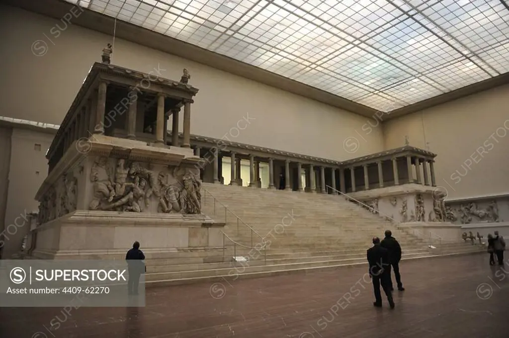 Pergamon Altar. Built by order of Eumenes II Soter. 164-156 BC by artists of the school of Pergamon. Marble and limestone. First, Gigantomachy, West frieze. Left to right: Amphitrite and his son Triton fighting the giants. Pergamon Museum. Berlin. Germany.