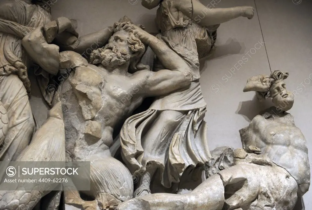 Pergamon Altar. Built by order of Eumenes II Soter. 164-156 BC by artists of the school of Pergamon. Marble and limestone. North frieze. The three Moirai, goddesses of fate, kill the Giants Agrios and Thoas with bronze clubs. Pergamon Museum. Berlin. Germany.