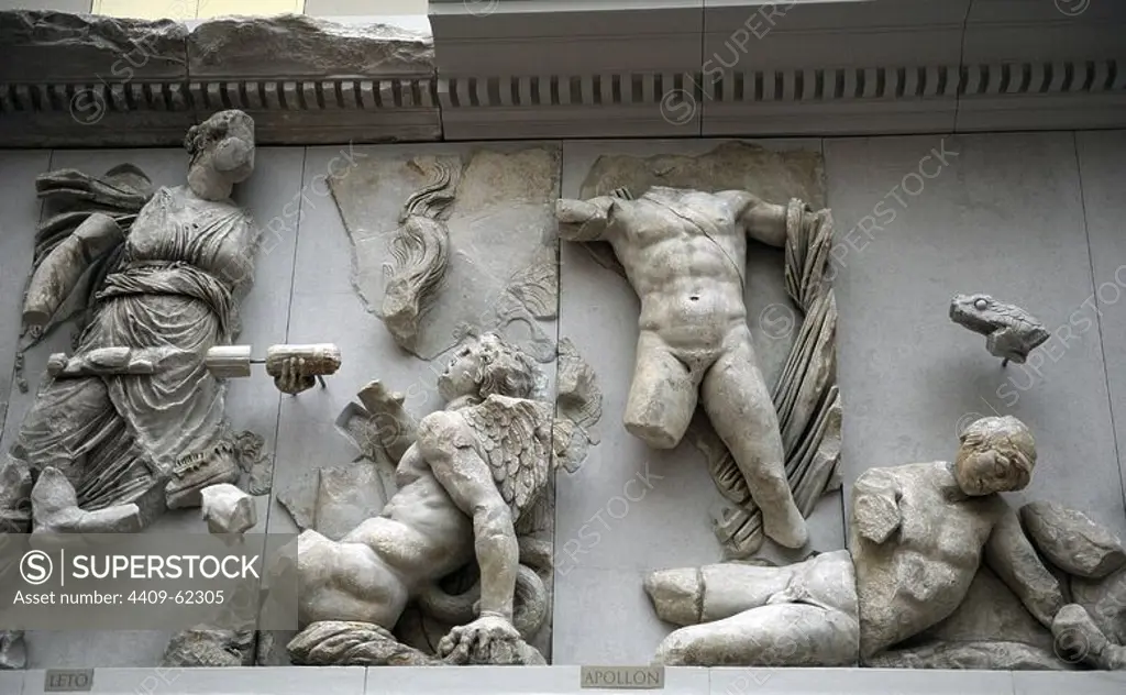Pergamon Altar. Built by order of Eumenes II Soter. 164-156 BC by artists of the school of Pergamon. Marble and limestone. East frieze. Gigantomachy. Leto fights using a torch against titan Tityos. At her other side Apollo fights armed with bow and arrow and has just shot Ephialtes, who lies at his feet. Pergamon Museum. Berlin. Germany.