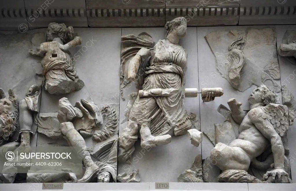 Pergamon Altar. Built by order of Eumenes II Soter. 164-156 BC by artists of the school of Pergamon. Marble and limestone. East frieze. Gigantomachy. Artemis fights with Otos (probably) while her mother Leto fights using a torch against titan Tityos. Pergamon Museum. Berlin. Germany.