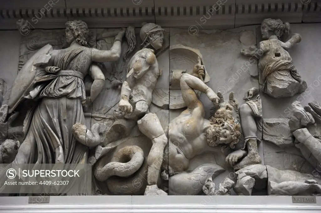 Pergamon Altar. Built by order of Eumenes II Soter. 164-156 BC. Marble and limestone. Gigantomachy. South frieze. The three-faceted goddess Hecate fighting with a torch, a sword and a lance against the giant Klytios (he doesn't appear). Next to her is Artemis fighting with a bow and arrow against a Giant who is perhaps Otos. Her hunting dog kills another Giant with a bite to the neck. Pergamon Museum. Berlin. Germany.