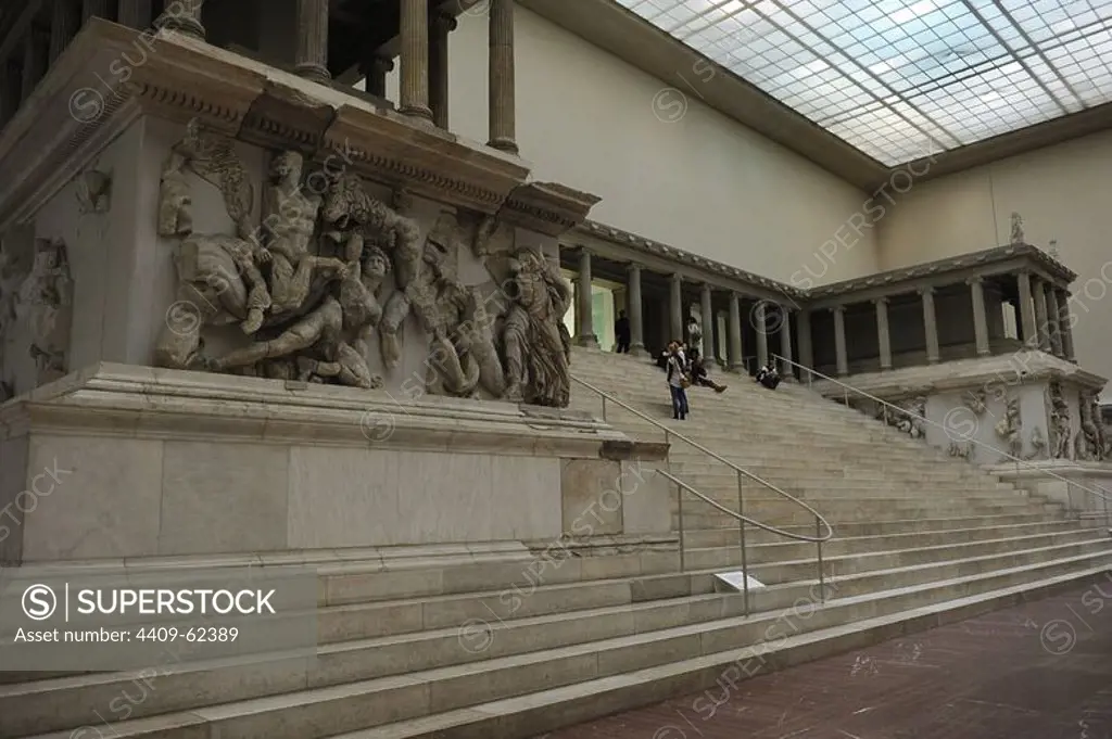 Pergamon Altar. Built by order of Eumenes II Soter. 164-156 BC by artists of the school of Pergamon. Marble and limestone. First, Gigantomachy, West frieze. Left to right: Amphitrite and his son Triton fighting the giants. Pergamon Museum. Berlin. Germany.