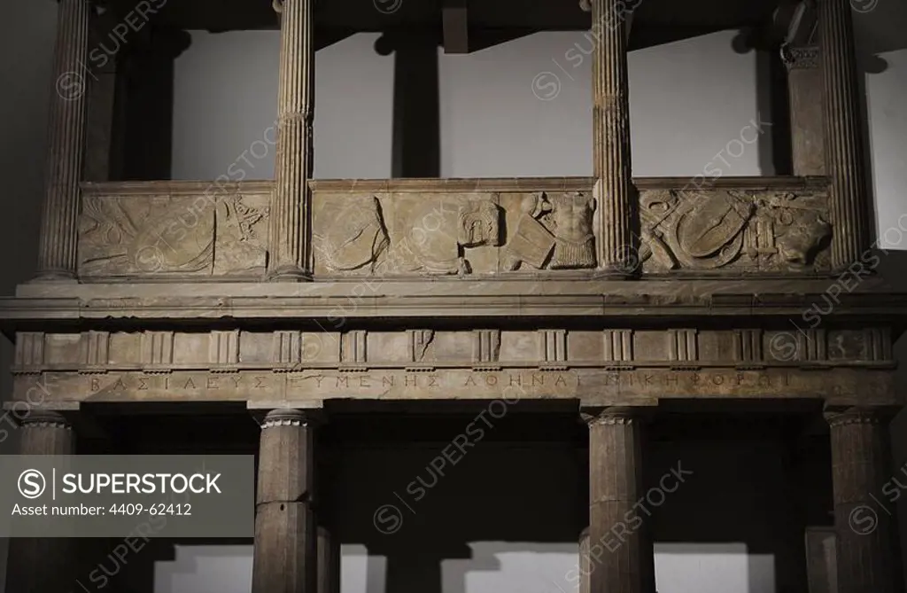 Propylaea of __the Sanctuary of Athena. 3rd - 2nd centuries BC. Architrave with the dedication from king Eumenes to Athena Nikephore. At the balcony, the weapons of the defeates Galates. Detail. Acropolis of Pergamum. Pergamon Museum. Berlin. Germany.